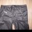 Černé lesklé kalhoty se stříbrnými zipy Oodji - foto č. 2